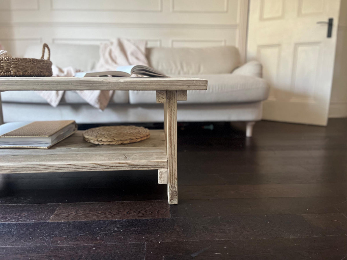 Rustic style coffee table, front view, in a living room setting. 