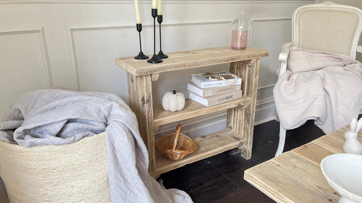 Nautical-themed room with wooden bookcase candles, and decor items.