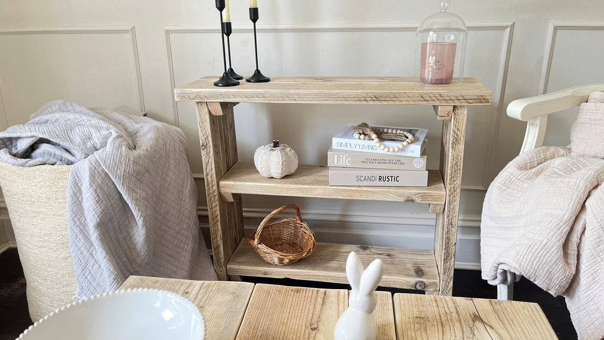Wooden bookcase with decorative items in a cozy room setting