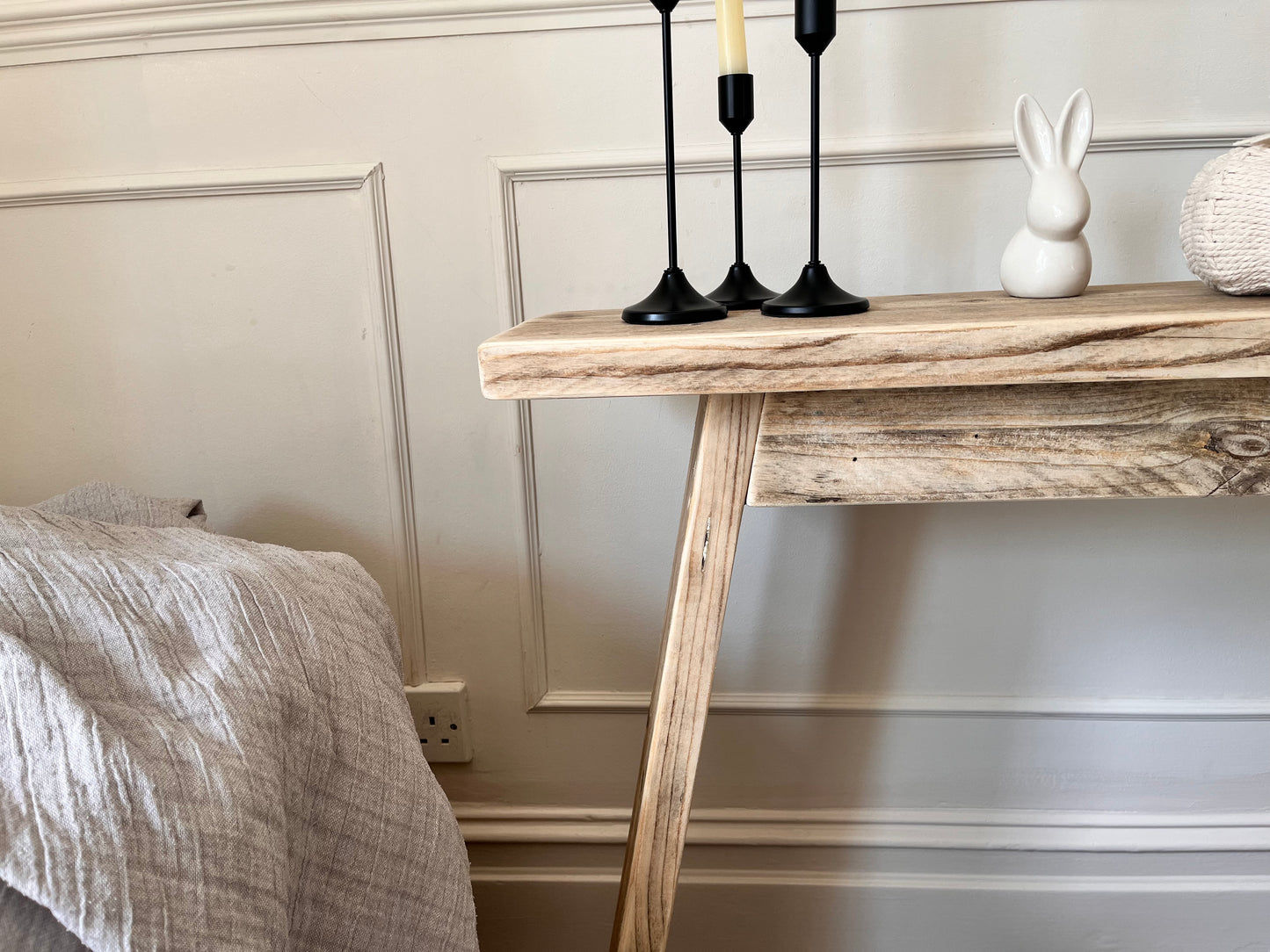 Close up view of a wood console table in a farmhouse, rustic design