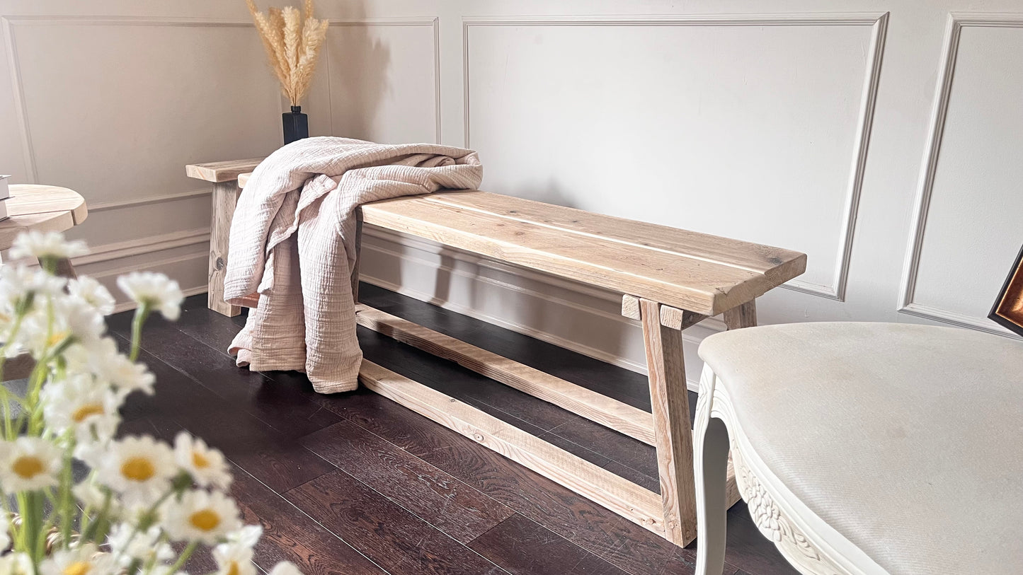 Farmhouse style wooden bench. Handmade in the UK, front view.