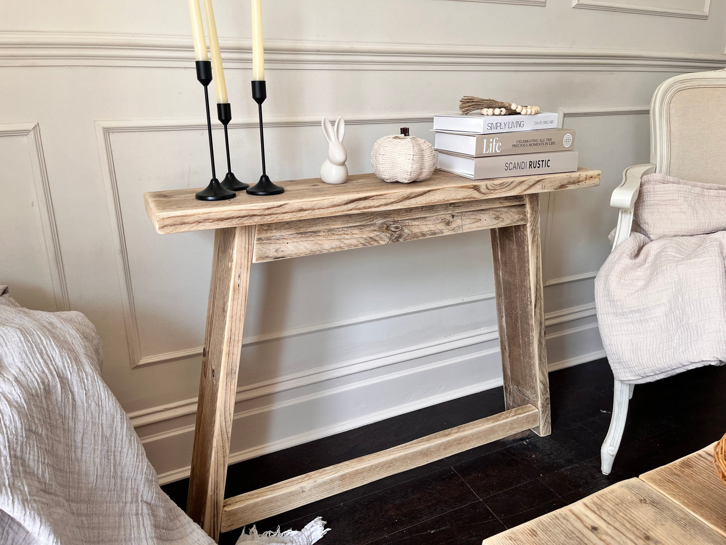 Rustic styled wooden console table in a farmhouse style.