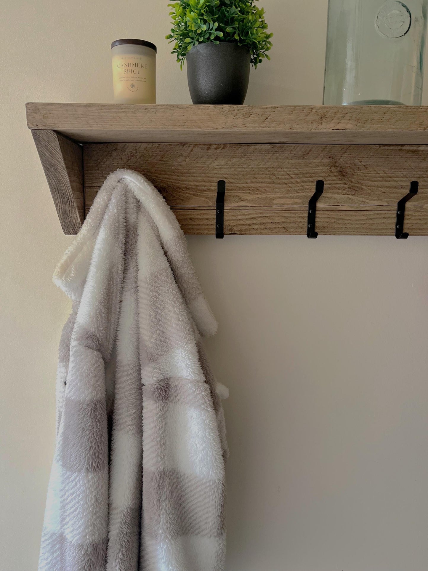 Farmhouse style wooden shelf with hooks (front view)