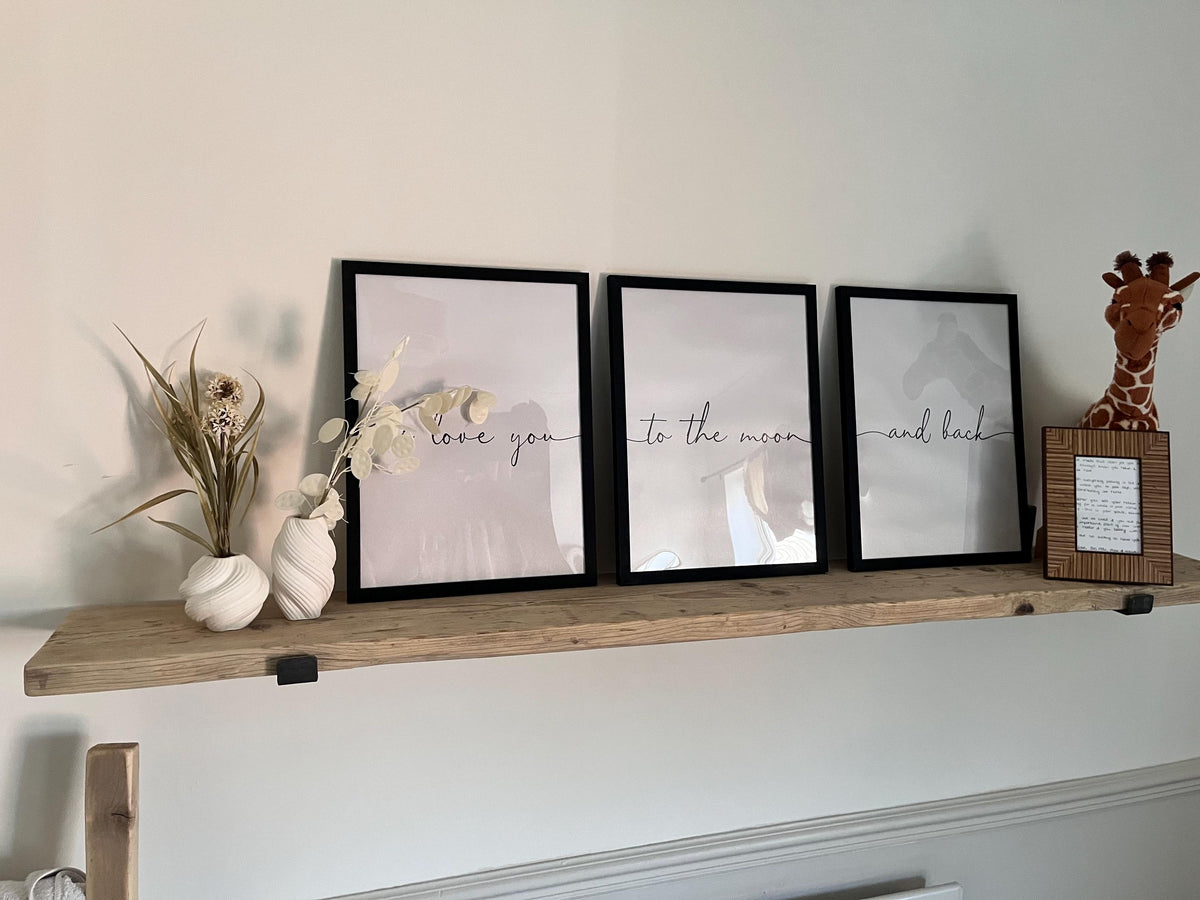 A farmhouse style rustic wooden console table with a bottom shelf, in a living room setting (front view)