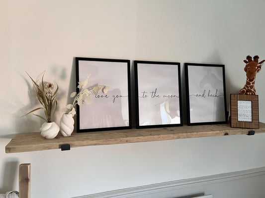 A farmhouse style rustic wooden console table with a bottom shelf, in a living room setting (front view)
