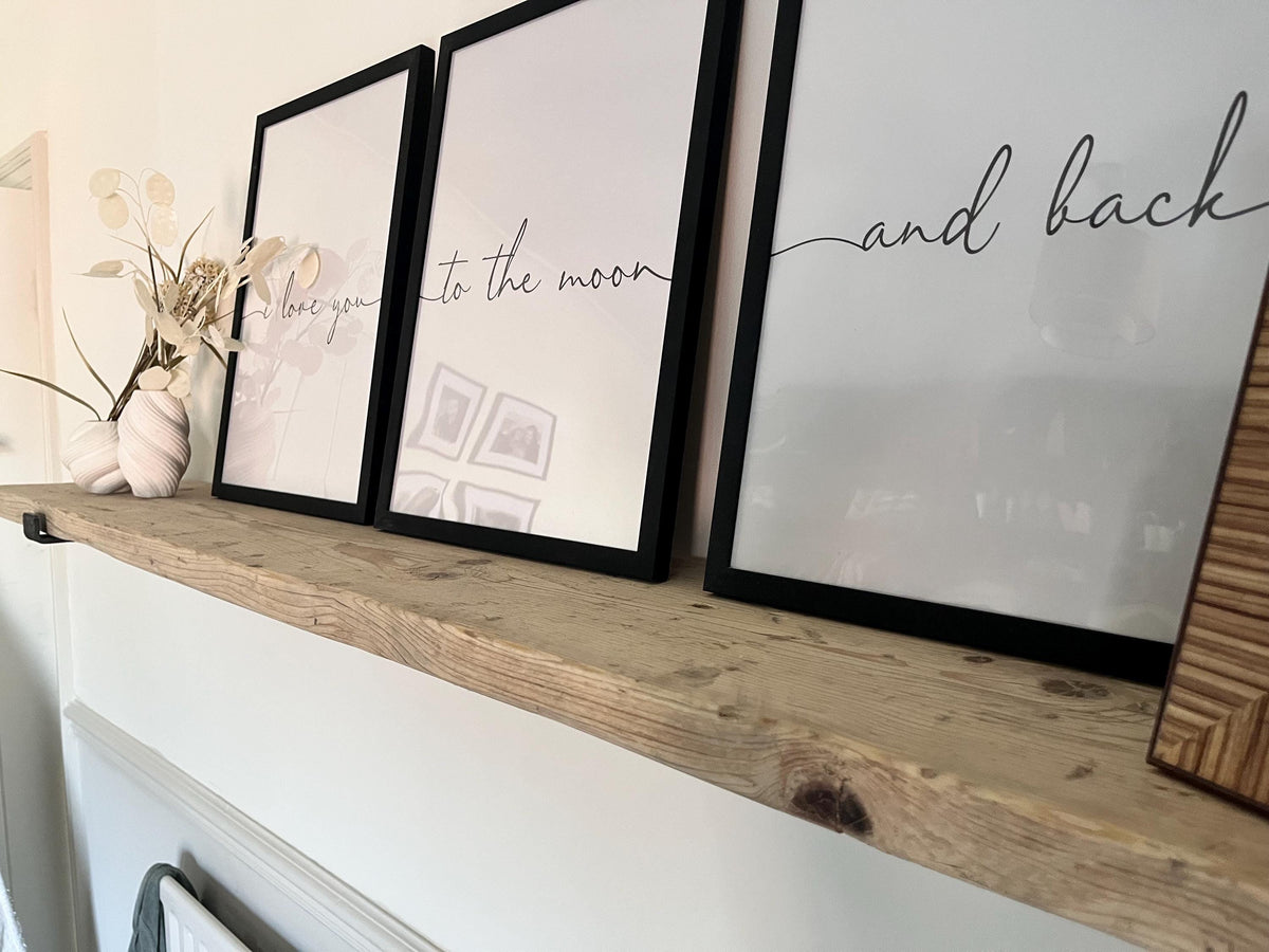 A farmhouse style rustic wooden console table with a bottom shelf, in a living room setting (front view)
